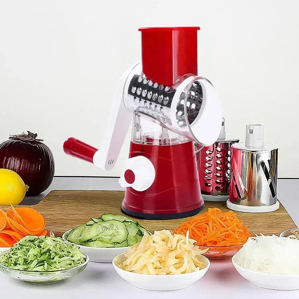 Manual vegetable rotary grater and slicer with bowls of shredded carrots, cucumbers, and cheese
