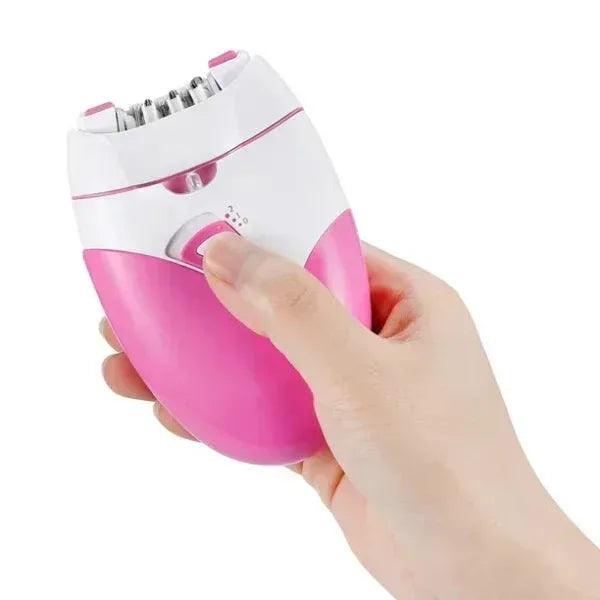 Hand holding a pink and white electric facial hair remover epilator