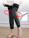 Black compression knee support sleeve with green accents and spring stabilizer for joint pain