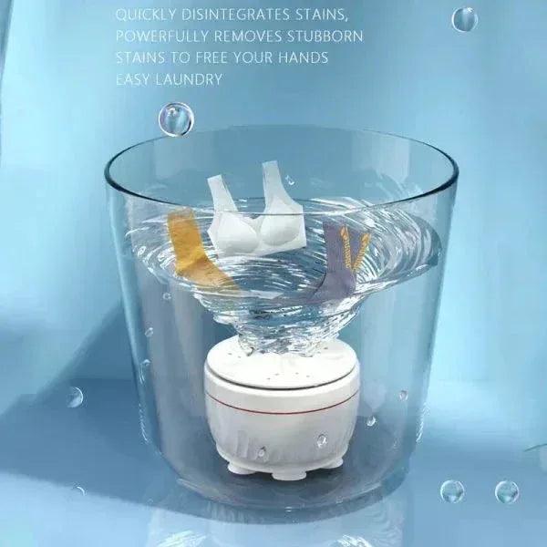 Portable mini washing machine cleaning white undergarments in a clear tub