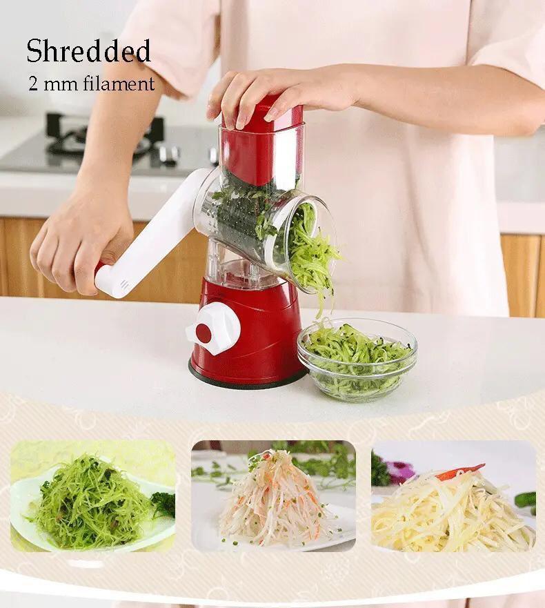 Hand-operated red vegetable shredder making 2mm thin julienne strips of green vegetables