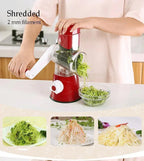 Hand-operated red vegetable shredder making 2mm thin julienne strips of green vegetables