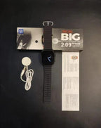 T900 Ultra smartwatch with charger and user manual next to its packaging box